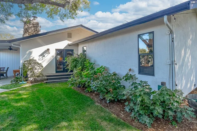 a view of a chairs and table in the balcony