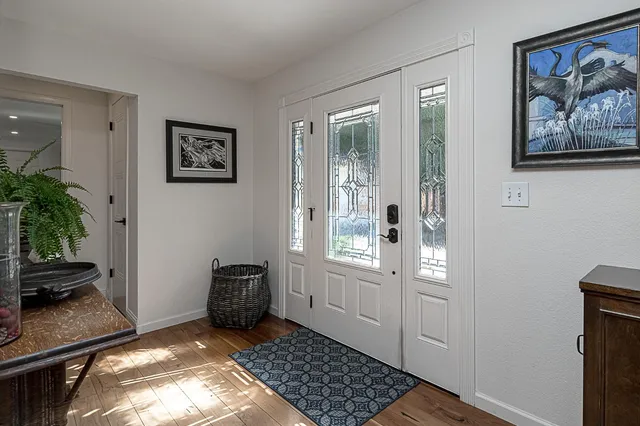 a view of a living room and chandelier