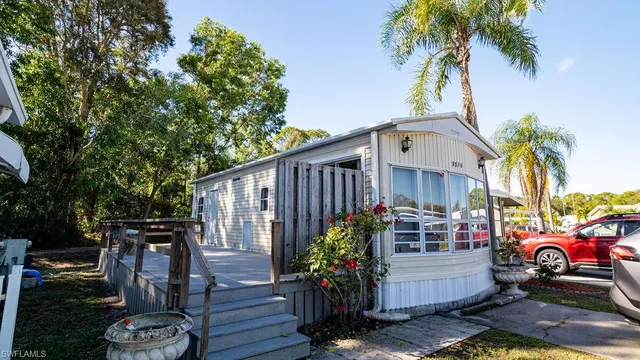a view of a car park in front of a house