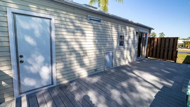 a view of balcony with wooden floor