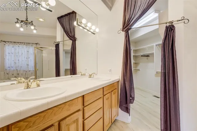a bathroom with a sink double vanity and a mirror