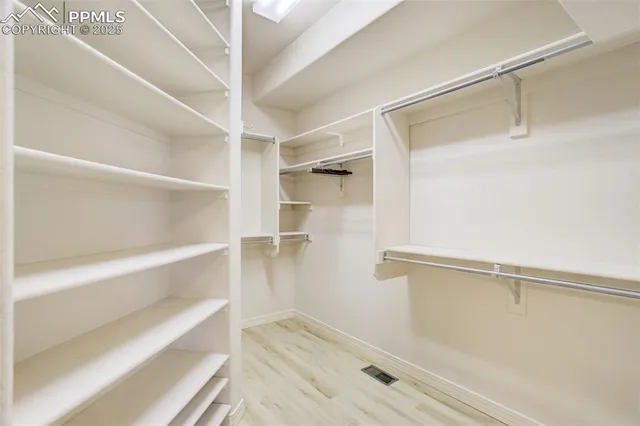 a view of an empty walk in closet