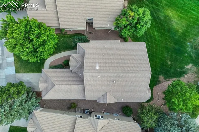 a picture of a room with a white wall and a white refrigerator