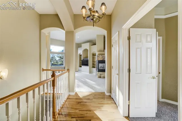 a view of a hallway with a dining area