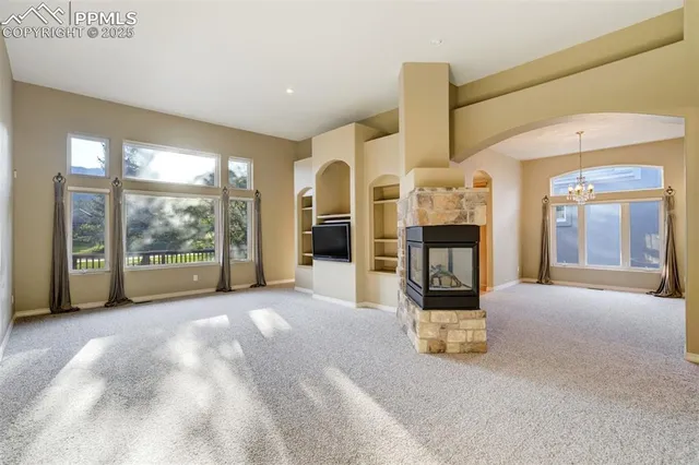 a view of lobby with furniture and large windows