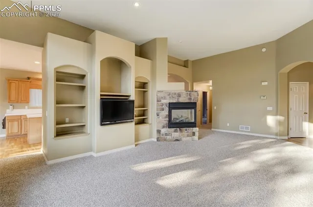 a view of livingroom with furniture and flat screen tv