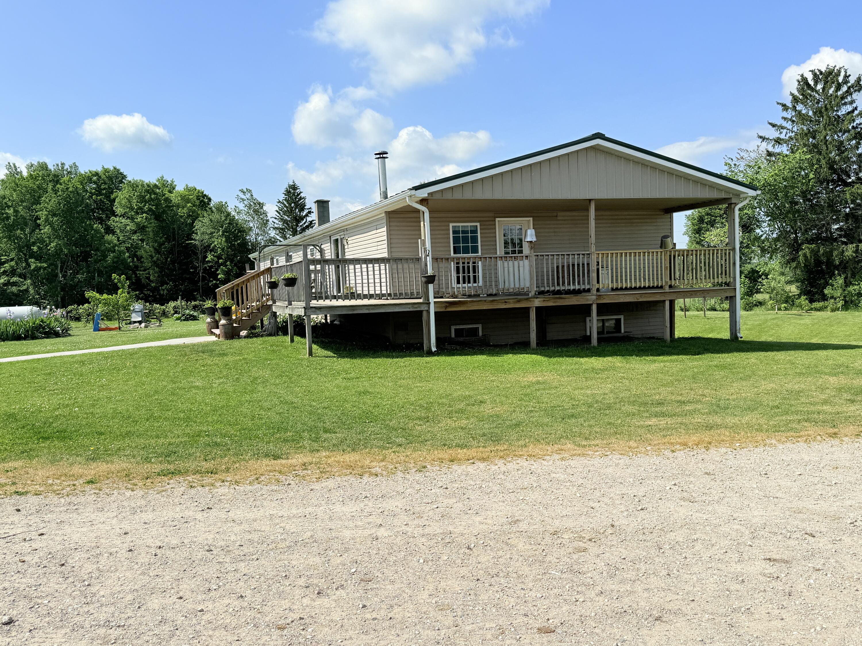 21576 Patterson Road, Unit OPTION B Tustin, MI 49688 - Photo 3 of 13 IMG_0824