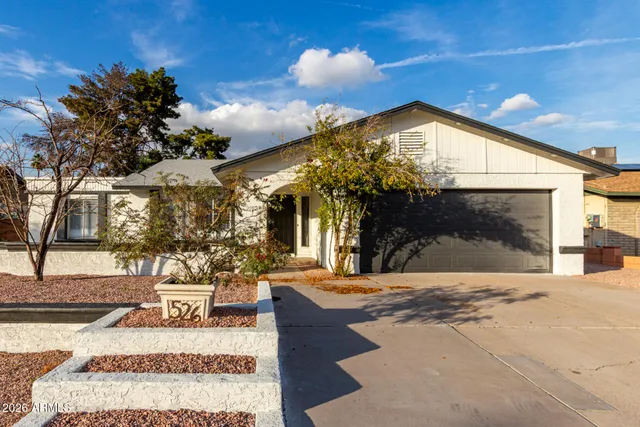 a view of a house with a snow in the yard