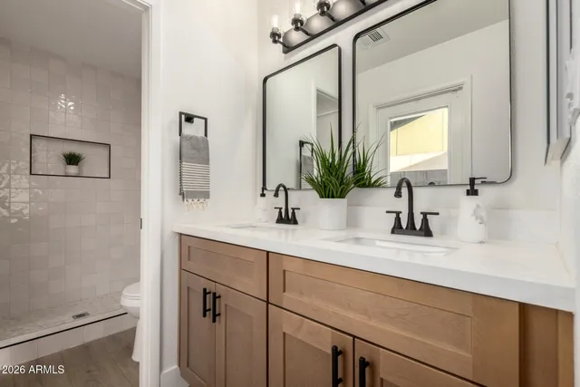 a bathroom with a shower and a toilet