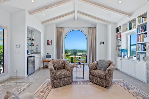 a living room with furniture and a window