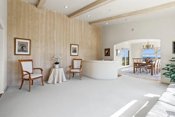 a living room with furniture and a table