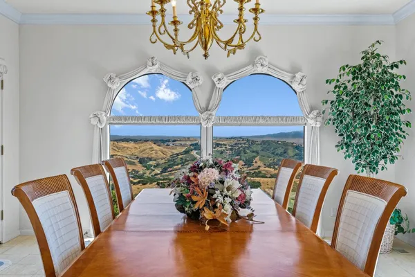 a view of balcony with furniture and wooden floor