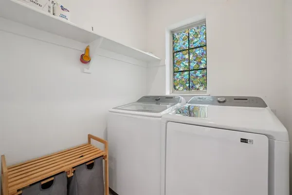 a utility room with dryer and washer