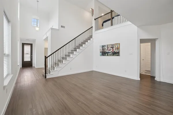 a view of entryway with wooden floor