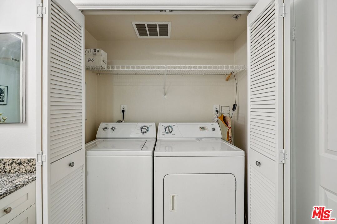 100 South Alameda Street, Unit 477 Los Angeles, CA 90012 - Photo 13 of 24 a utility room with dryer and washer