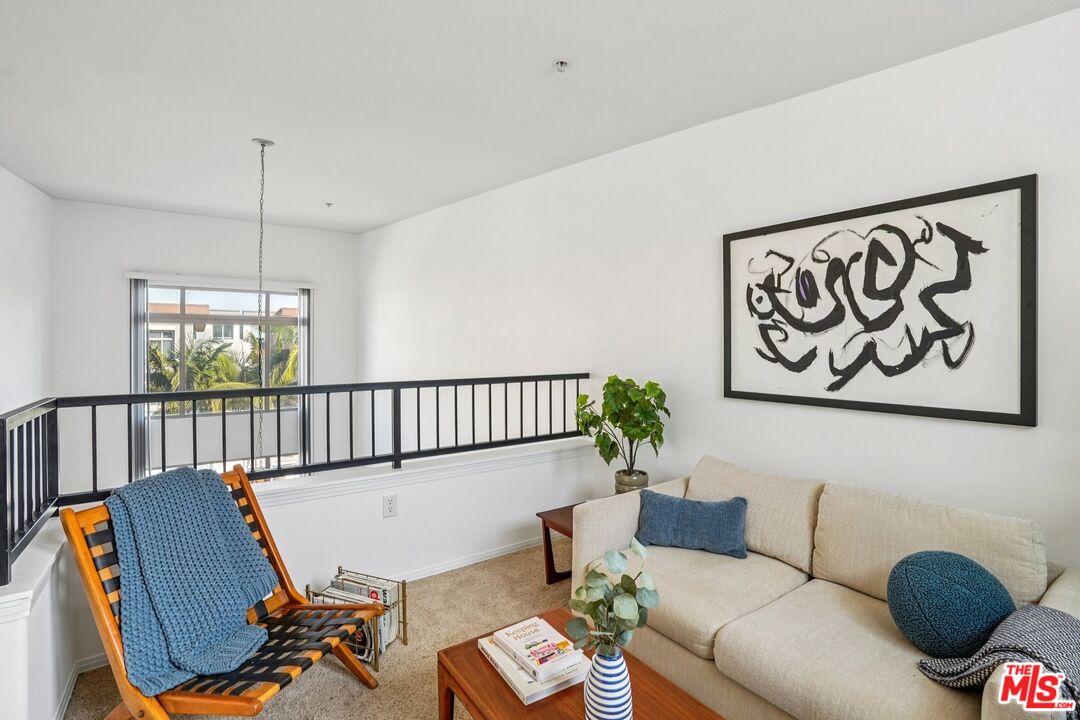 100 South Alameda Street, Unit 477 Los Angeles, CA 90012 - Photo 15 of 24 a living room with furniture and a window