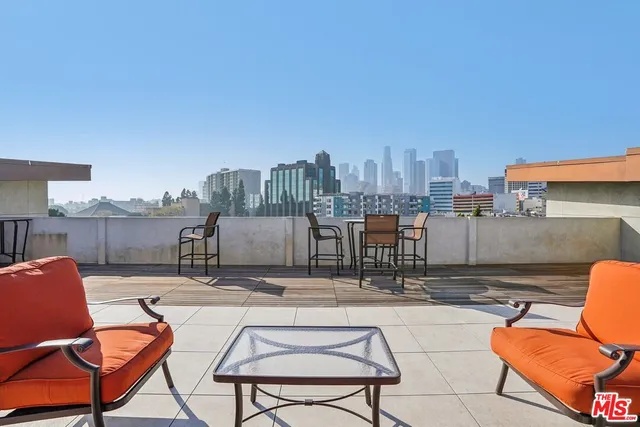 a view of a terrace with chairs and a table