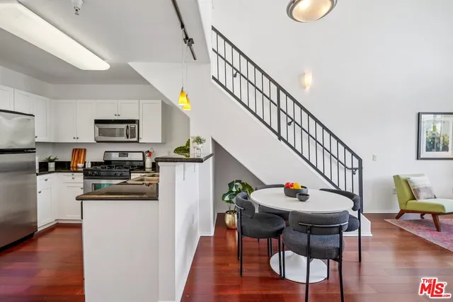 a dining room with wooden floor and a dining table