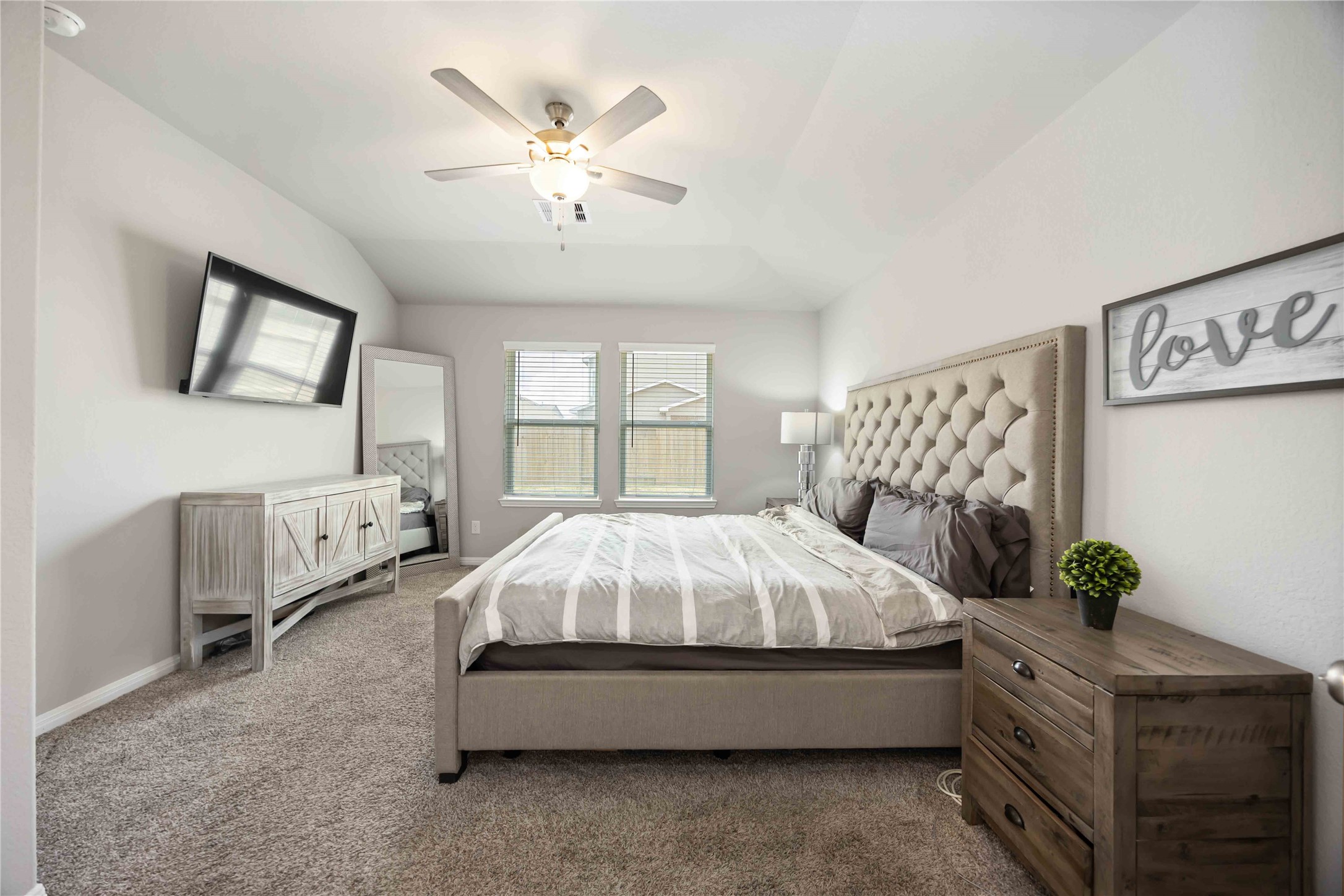 6910 Lebec Drive Rosharon, TX 77583 - Photo 16 of 26 a spacious bedroom with a bed and a chandelier