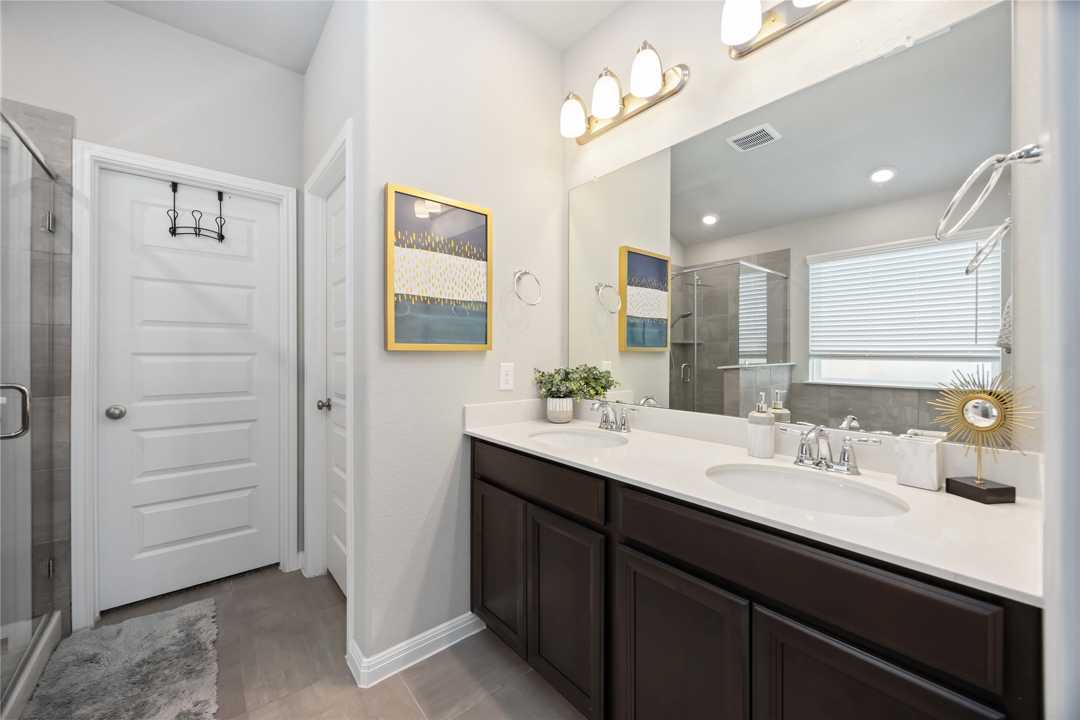 6910 Lebec Drive Rosharon, TX 77583 - Photo 19 of 26 a bathroom with a sink double vanity and a mirror
