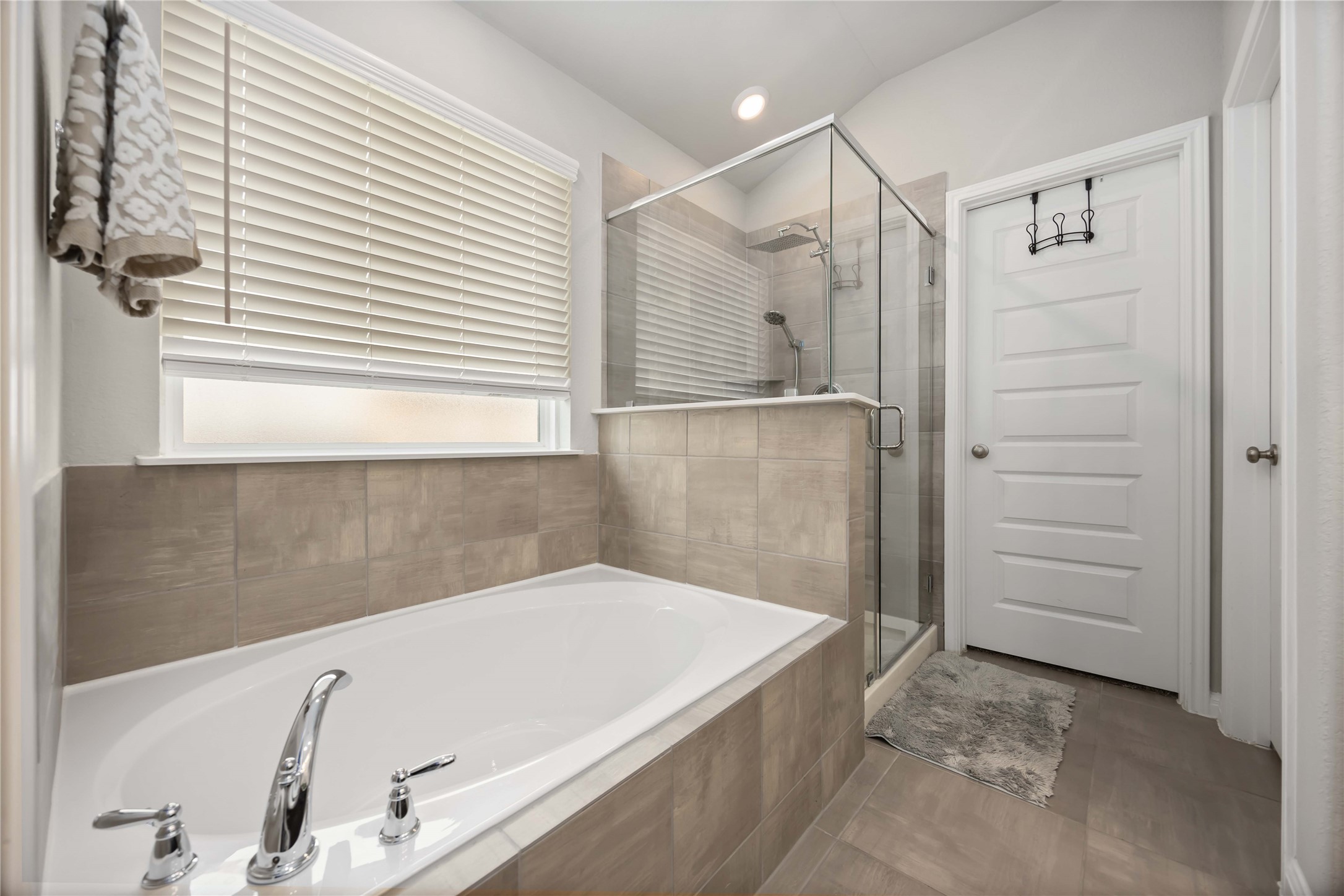 6910 Lebec Drive Rosharon, TX 77583 - Photo 20 of 26 a bathroom with a bathtub and a shower