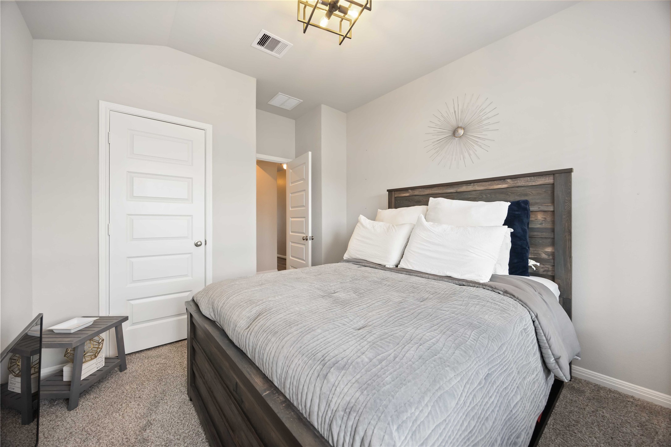 6910 Lebec Drive Rosharon, TX 77583 - Photo 21 of 26 a bedroom with a bed and cabinets