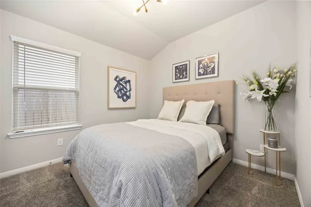 a view of a backyard with wooden fence