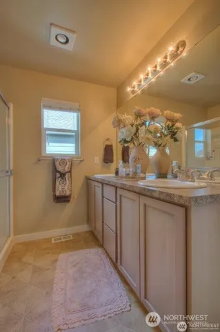 a bathroom with a sink a mirror and a toilet