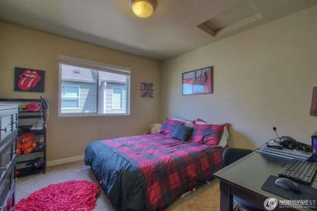 a bed room with a bed and a tv