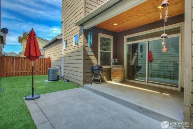 a view of a house with backyard and porch