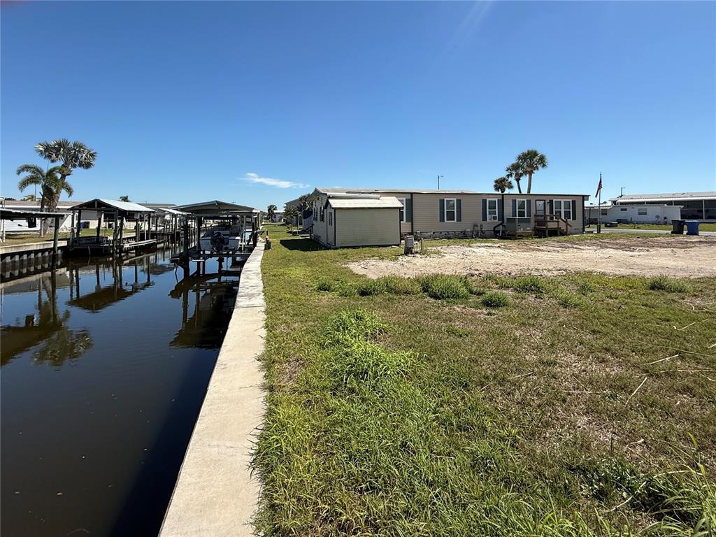 a view of a water fountain and a view of residential houses with outdoor space