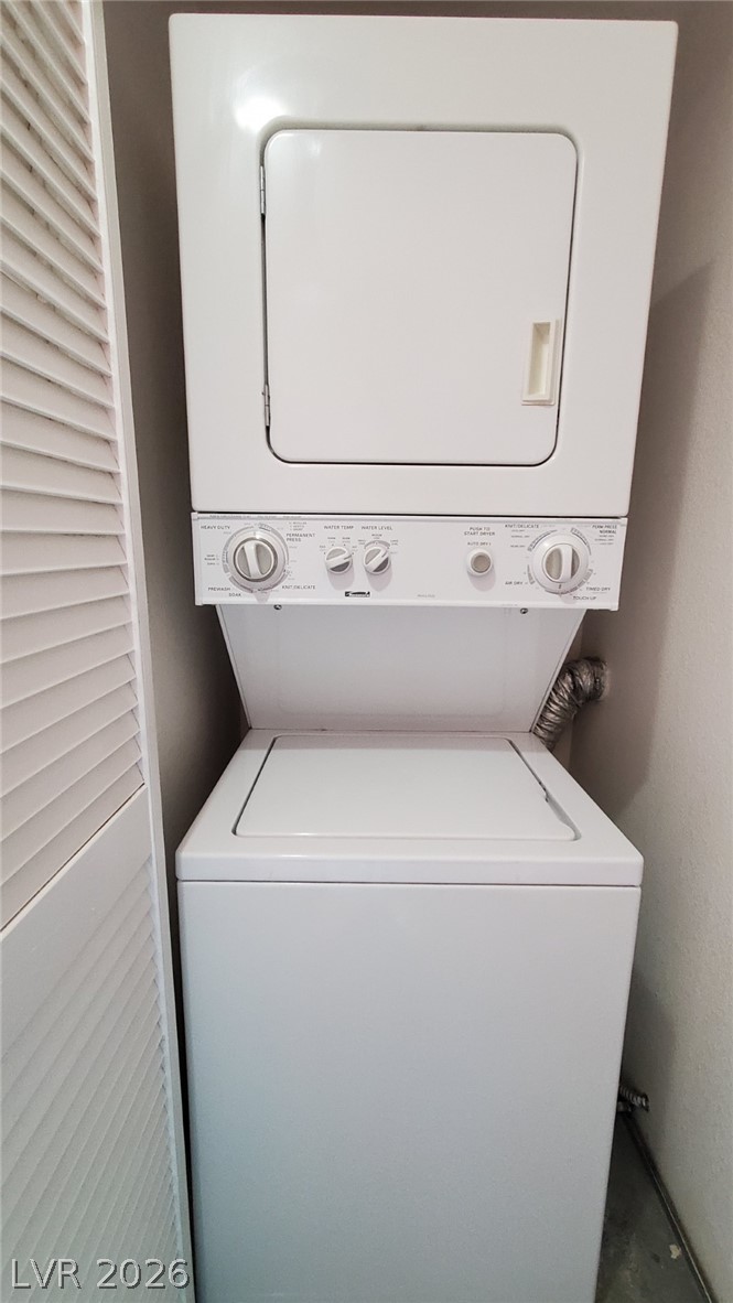 8070 West Russell Road, Unit 2105 Las Vegas, NV 89113 - Photo 8 of 10 A well-maintained stacked washer and dryer unit provides practical laundry solutions.