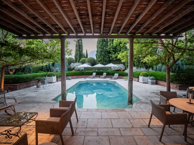 a view of a house with backyard porch and sitting area