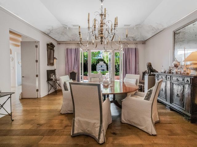 a view of a chairs and table in backyard