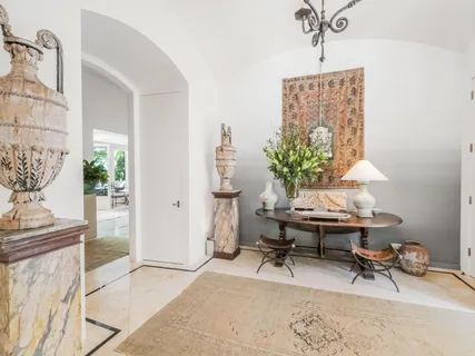 a bathroom with a tub sink and mirror