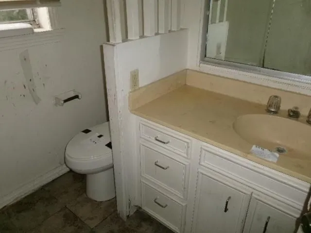 a bathroom with a sink and toilet