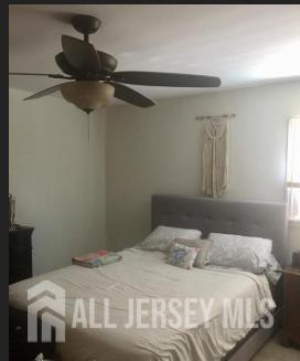 16 Inverness Terrace Fords, NJ 08863 - Photo 2 of 7 a bedroom with a bed and a window