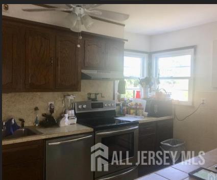 16 Inverness Terrace Fords, NJ 08863 - Photo 3 of 7 a kitchen with a sink cabinets and window