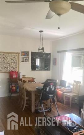 16 Inverness Terrace Fords, NJ 08863 - Photo 4 of 7 a living room with furniture and a chandelier