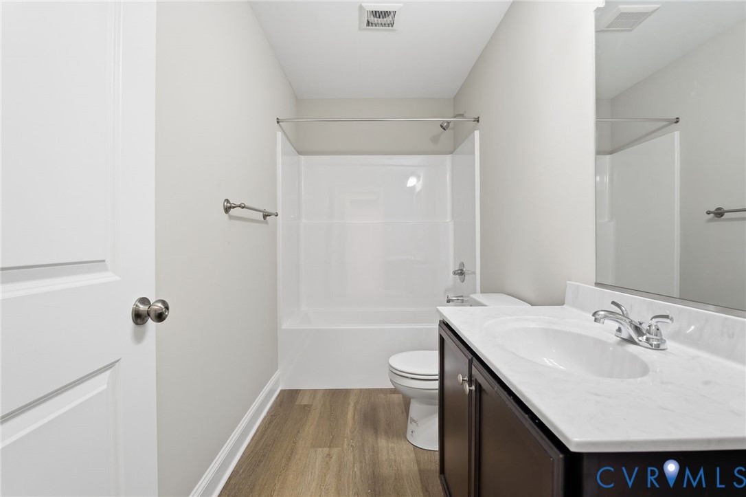 17557 Hewlett Road Beaverdam, VA 23015 - Photo 17 of 29 a bathroom with a sink and a mirror