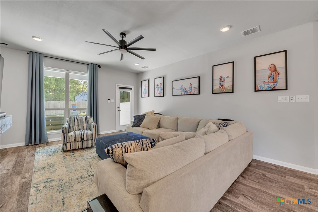 5010 Fallen Tree Drive Temple, TX 76502 - Photo 11 of 40 a living room with furniture ceiling fan and a window