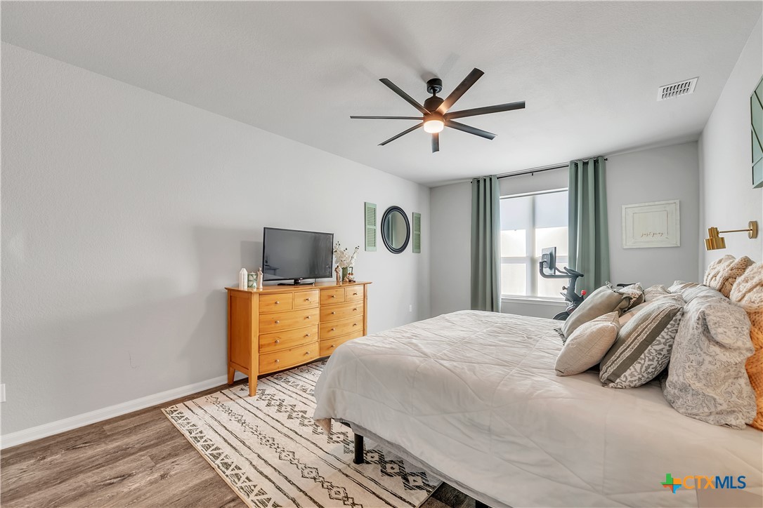 5010 Fallen Tree Drive Temple, TX 76502 - Photo 14 of 39 a bedroom with a bed and a mirror