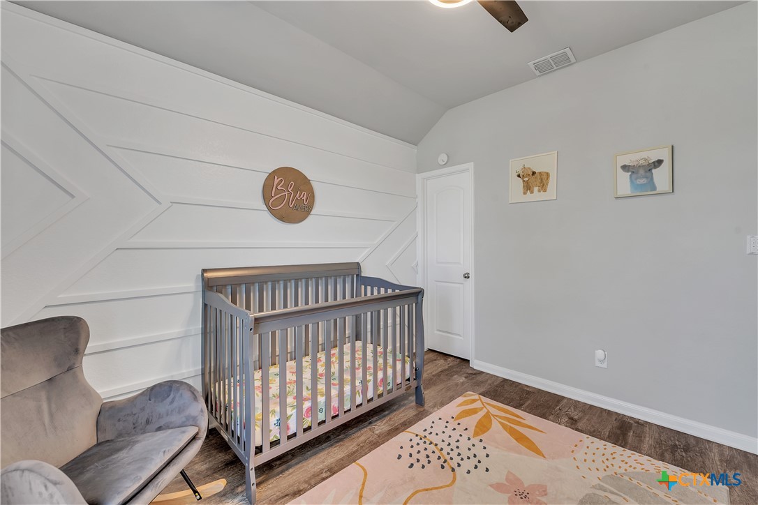 5010 Fallen Tree Drive Temple, TX 76502 - Photo 18 of 40 a bedroom with furniture and a window