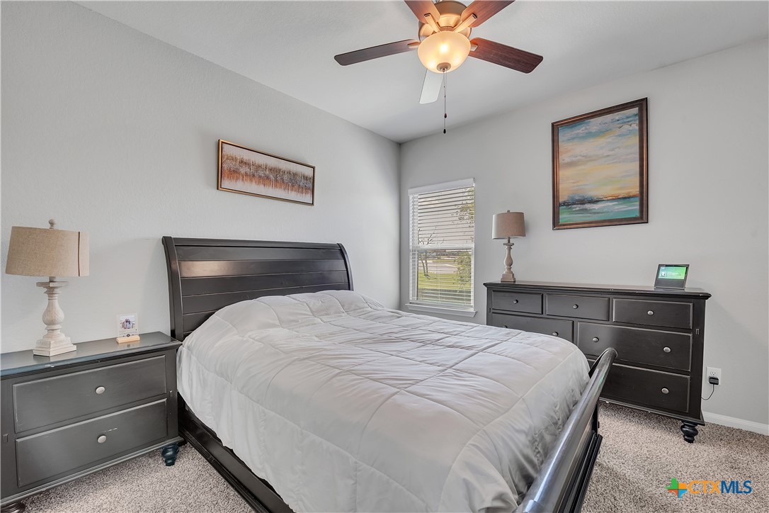 5010 Fallen Tree Drive Temple, TX 76502 - Photo 25 of 39 a bedroom with a bed and a dresser