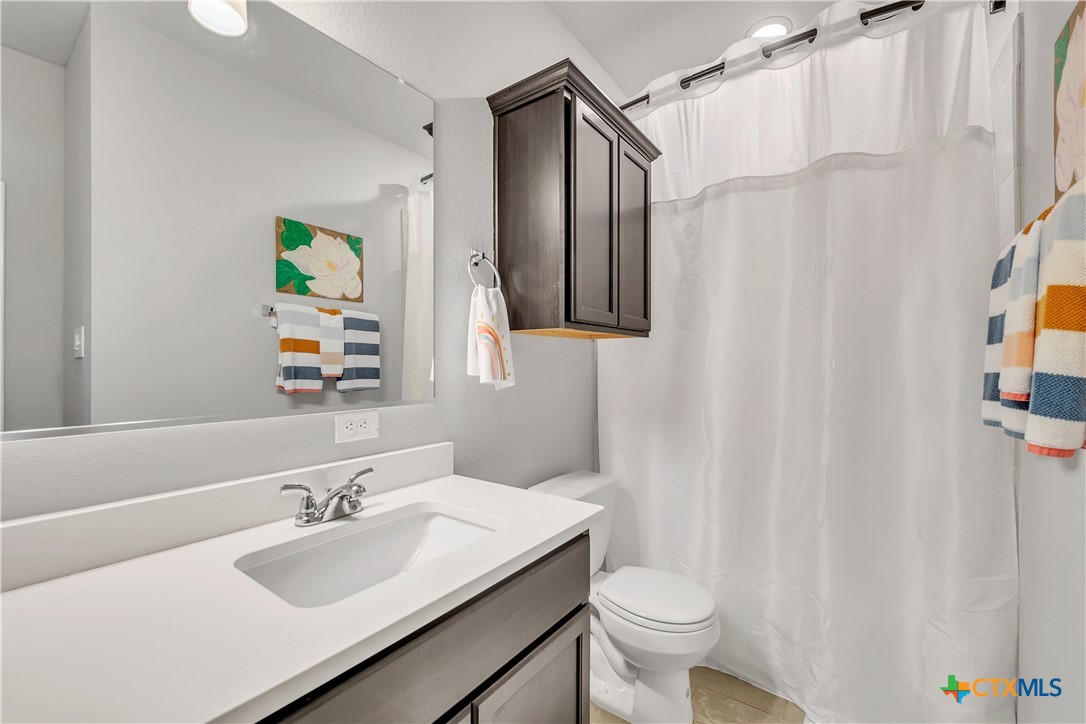 5010 Fallen Tree Drive Temple, TX 76502 - Photo 26 of 40 a bathroom with a sink toilet and shower