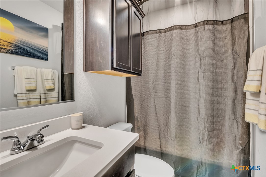 5010 Fallen Tree Drive Temple, TX 76502 - Photo 32 of 40 a bathroom with a sink and a mirror