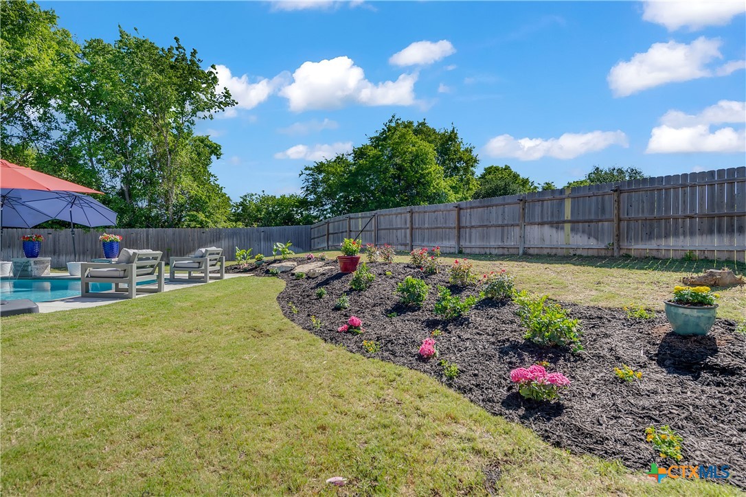 5010 Fallen Tree Drive Temple, TX 76502 - Photo 37 of 40 a view of a garden with sitting area