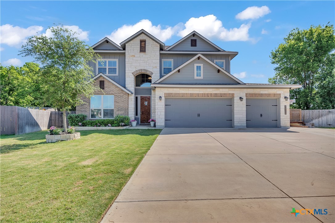 5010 Fallen Tree Drive Temple, TX 76502 - Photo 40 of 40 a front view of a house with a yard and garage