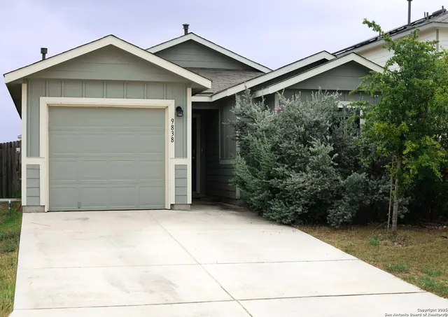 a front view of a house with garage