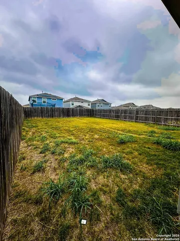 a view of a large pool with an ocean in the background